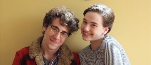 Two teens smiling at the camera